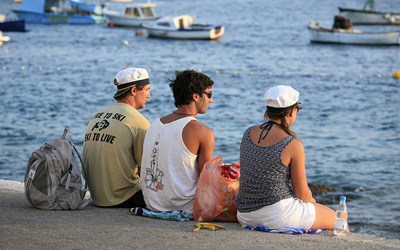 Croatian teenagers looking at boats in a bay, photo credit Alex E. Proimos on Flickr